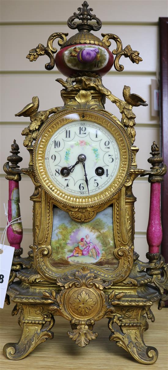 A late 19th century French ormolu and porcelain mantel clock, 17in.